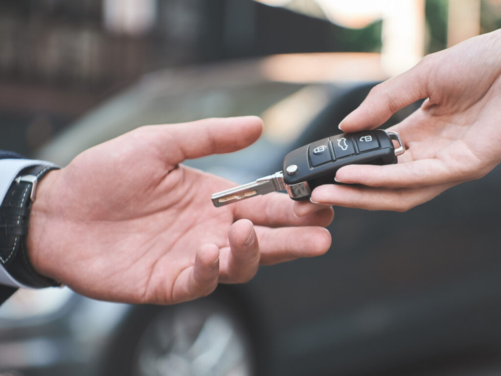 Golf Cruiser keys are being hand delivered to customer