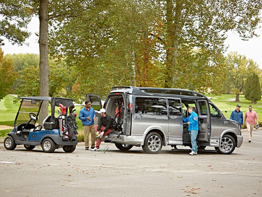 Guys getting out of their Golf Cruiser to go play golf